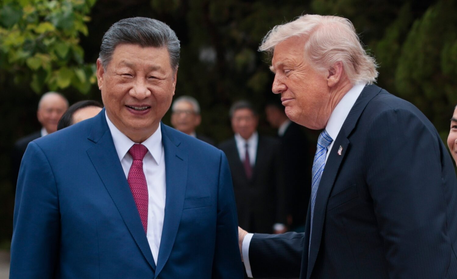 U.S. President Donald Trump, right, speaks with Chinese President Xi Jinping while leaving after a ...