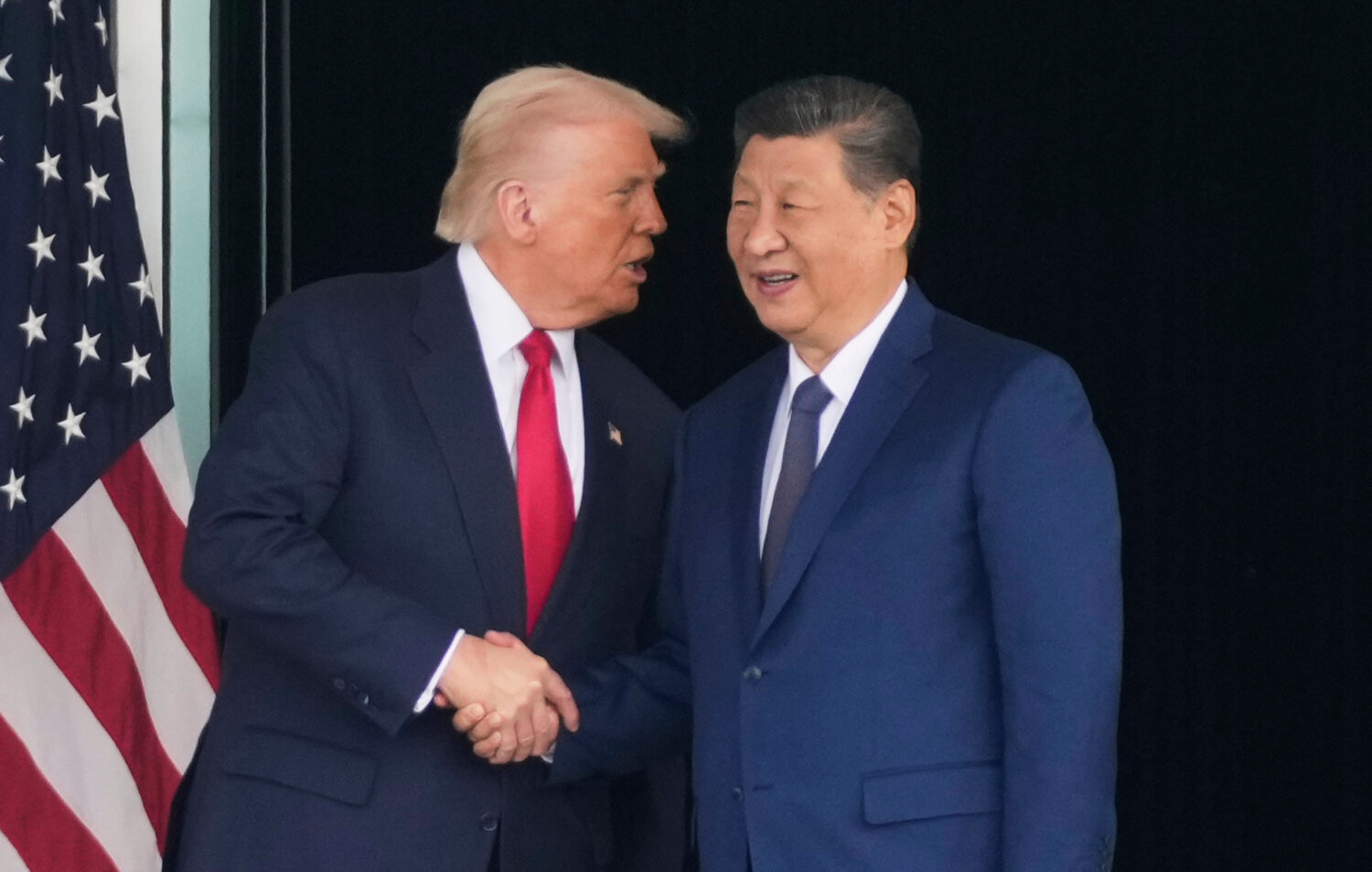 FILE - President Donald Trump, left, and Chinese President Xi Jinping, shake hands after their U.S....