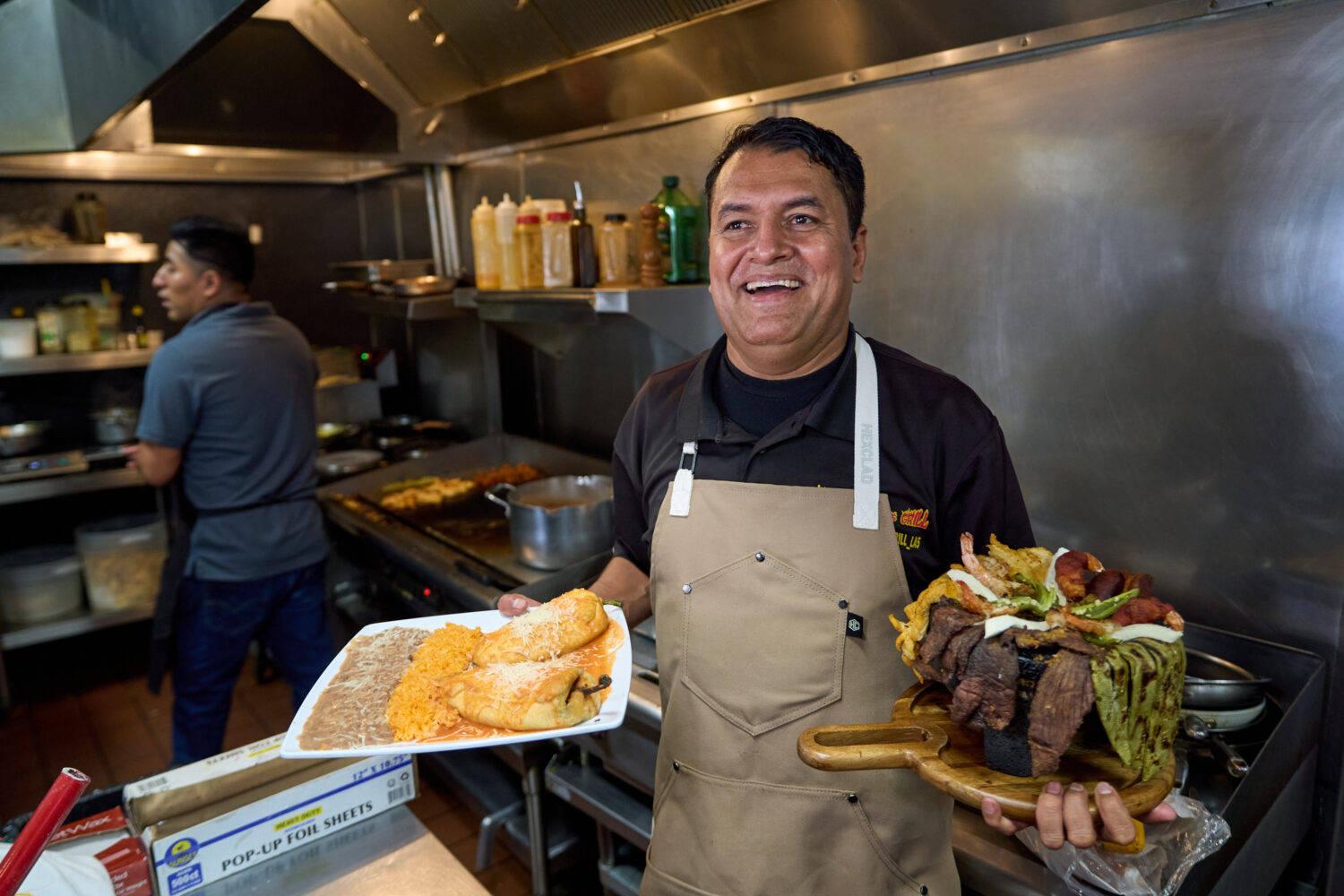 Mexican restaurant owner-chef Marco Mendoza prepares a hot molcajete, a traditional Mexican dish, a...