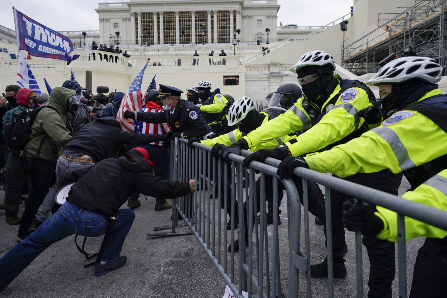 FILE - Metropolitan Police Department officers try to hold back rioters on the West Front at the U....