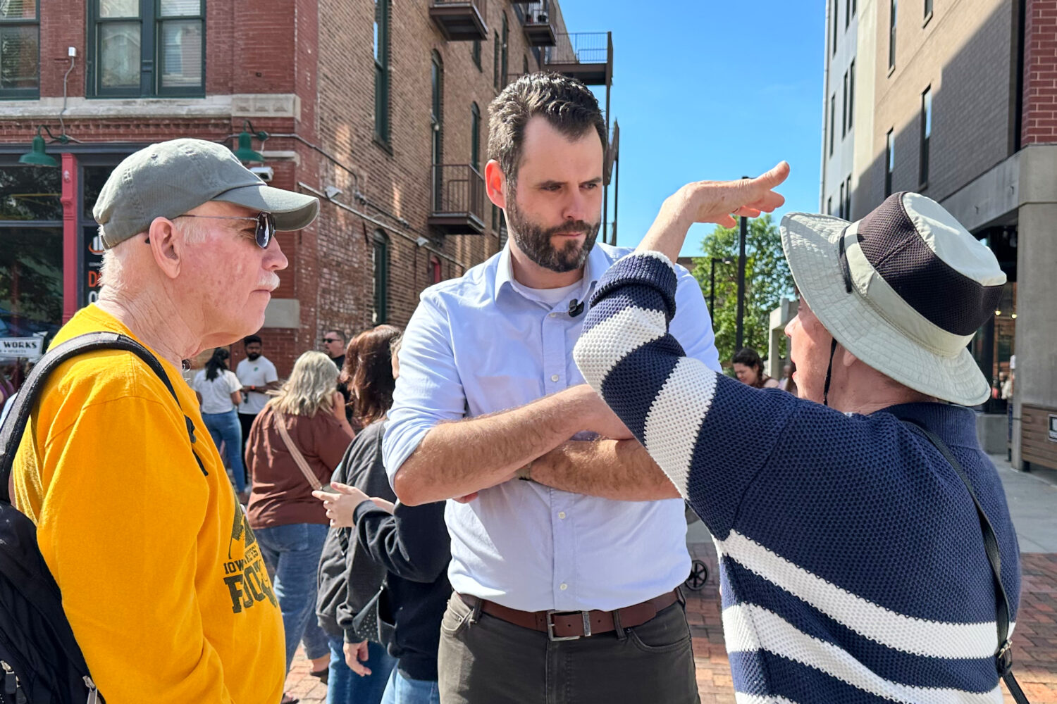 Iowa state Sen. Zach Wahls, a Democratic candidate for U.S. Senate, talks with voters in Des Moines...