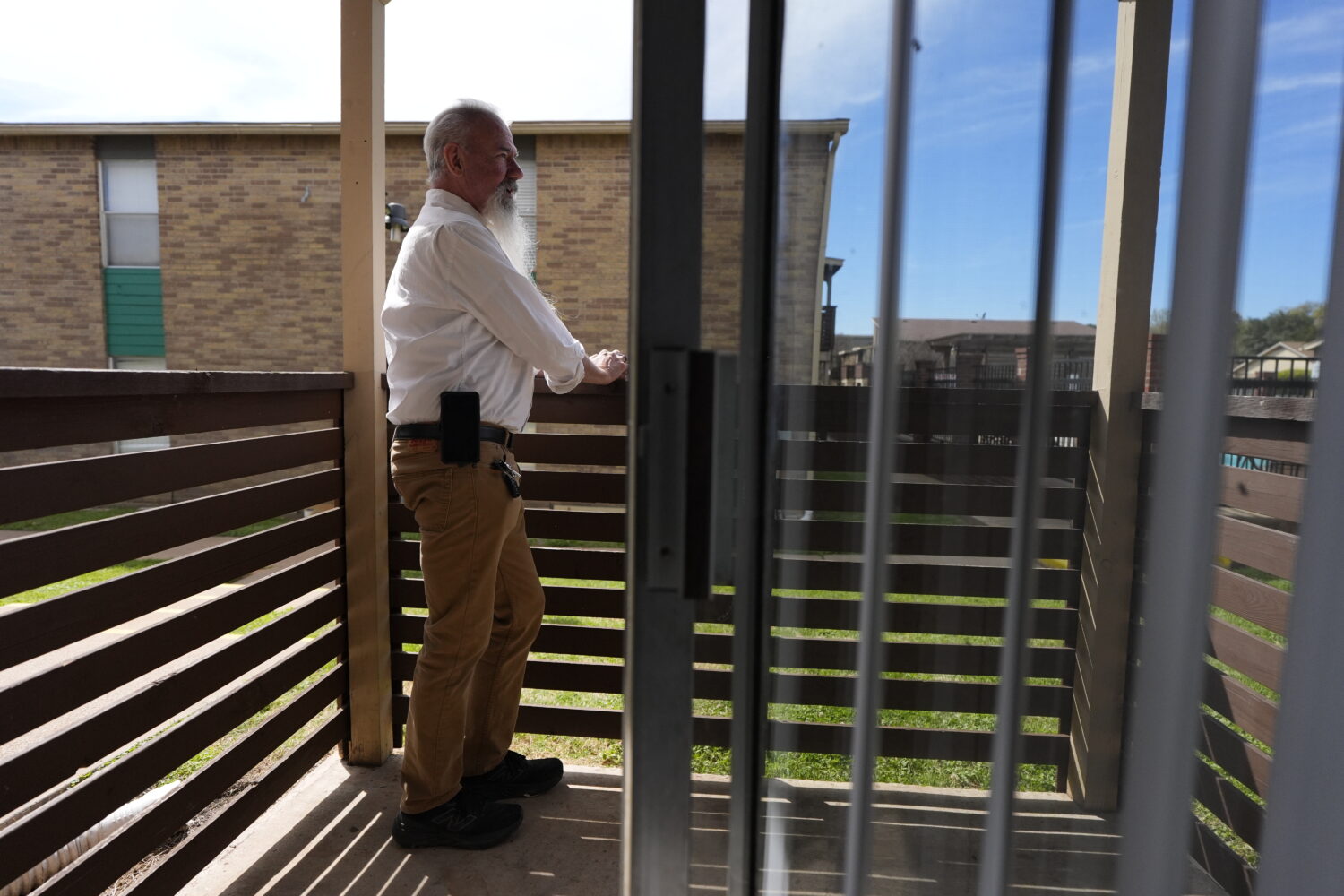 Matthew Haines, owner of the Oakwood Apartments, poses for a photo at the comminty housing location...