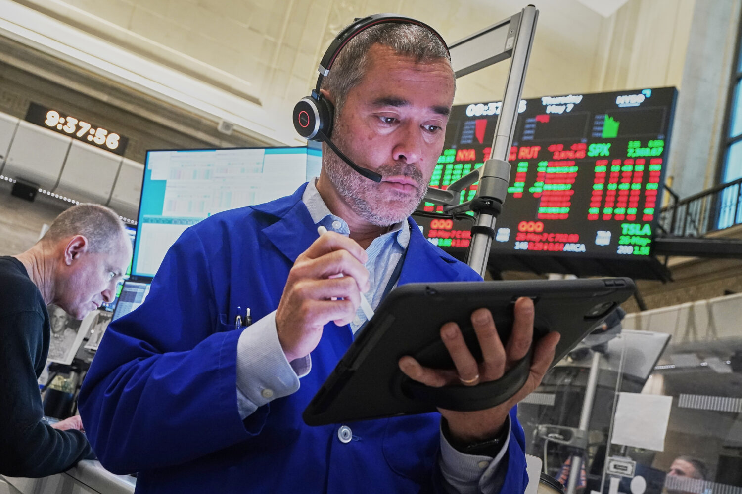 Options trader Justin Kanda works on the floor of the New York Stock Exchange, Thursday, May 7, 202...