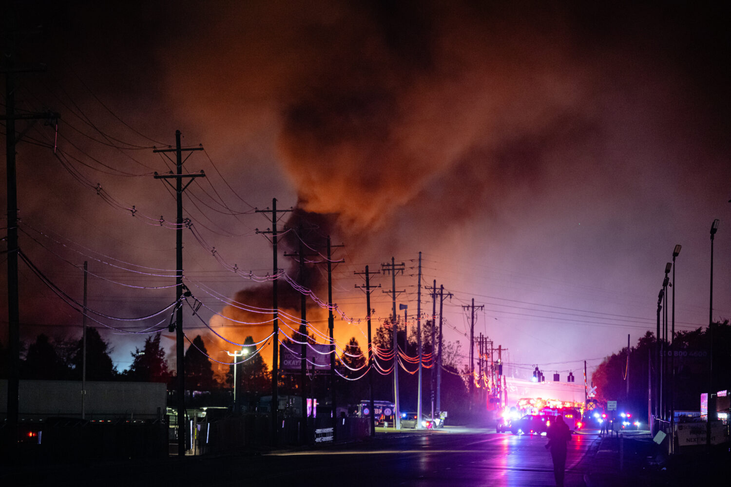 FILE - Plumes of smoke rise from the area of a UPS cargo plane crash at Louisville Muhammad Ali Int...