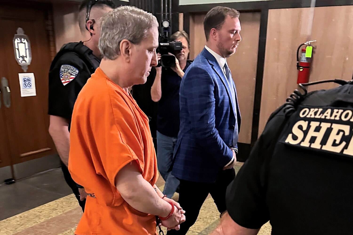 FILE - Oklahoma County Sheriff's deputies lead longtime death row inmate Richard Glossip to a court...