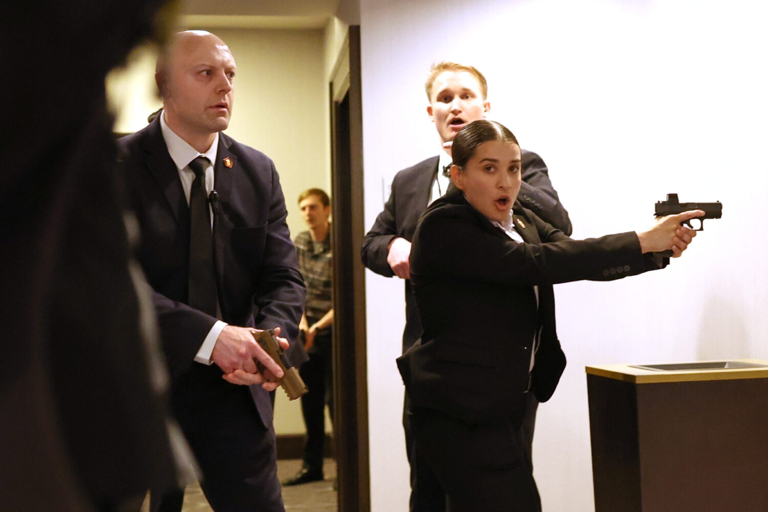 FILE - Secret service agents respond when a man, who authorities say, tried to storm the White Hous...