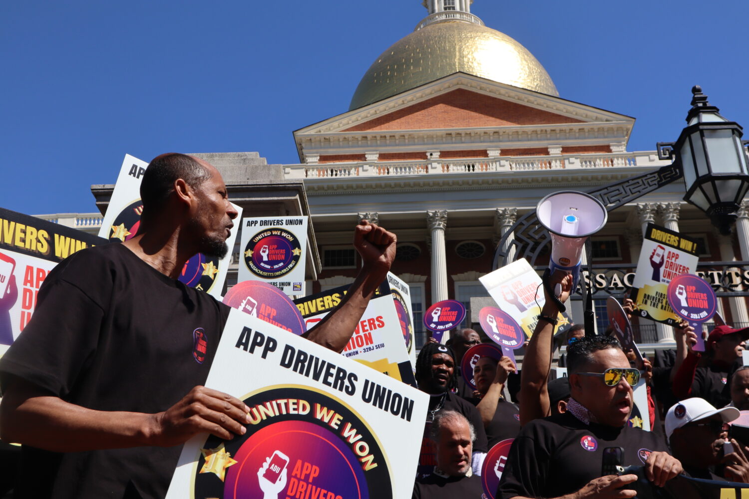 Members of the App Drivers Union hold a rally outside the Massachusetts State House after the annou...