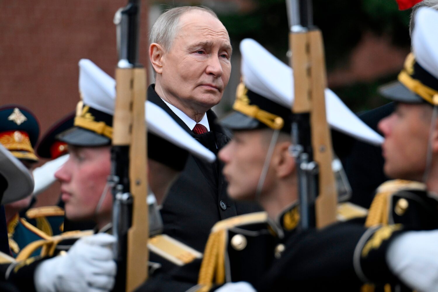 FILE - Russian President Vladimir Putin, rear center, attends a ceremony to lay flowers at the Tomb...