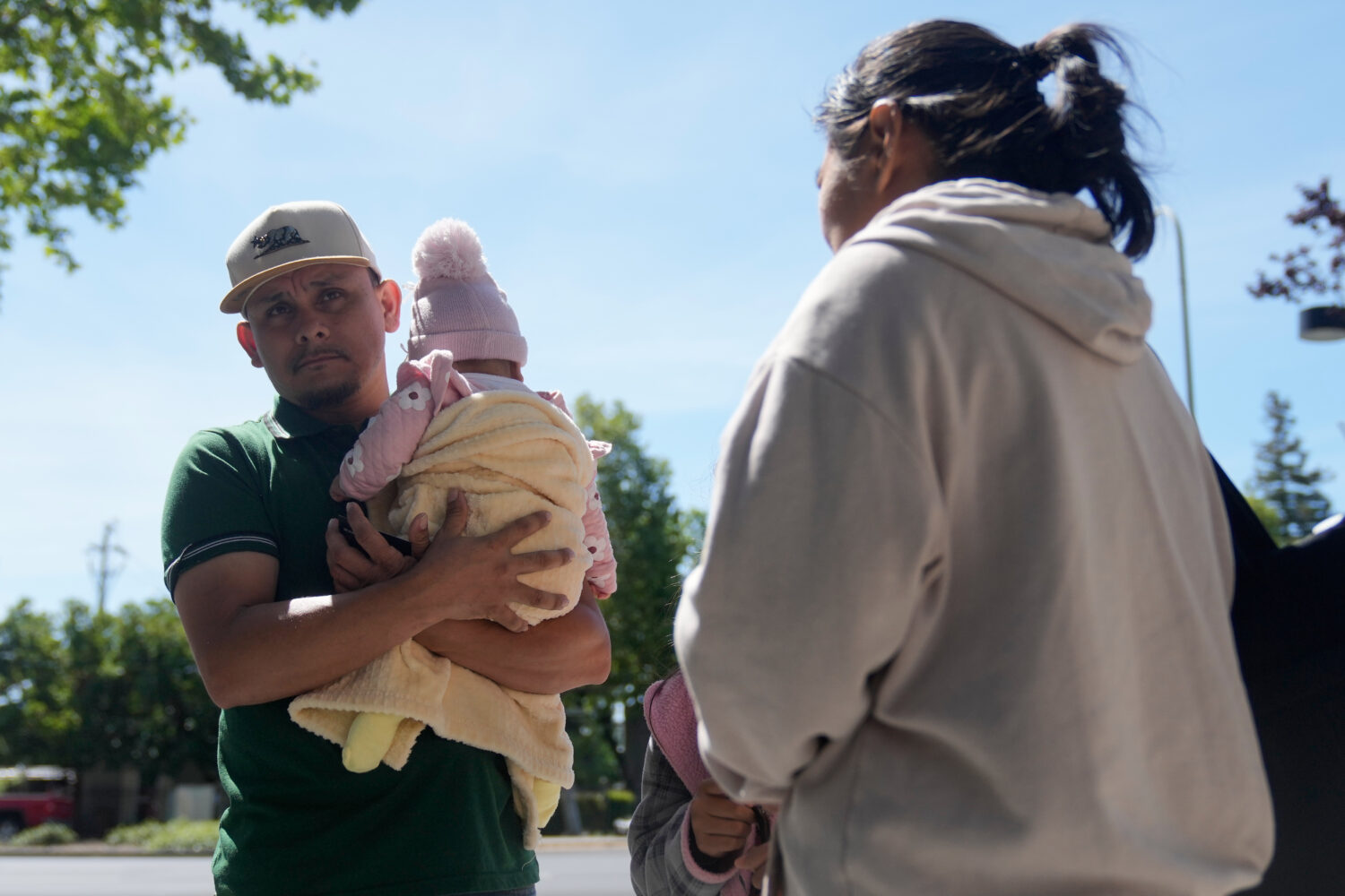 Oliverio Mora Huerta, left, is interviewed with his family before going to Immigration Court Tuesda...