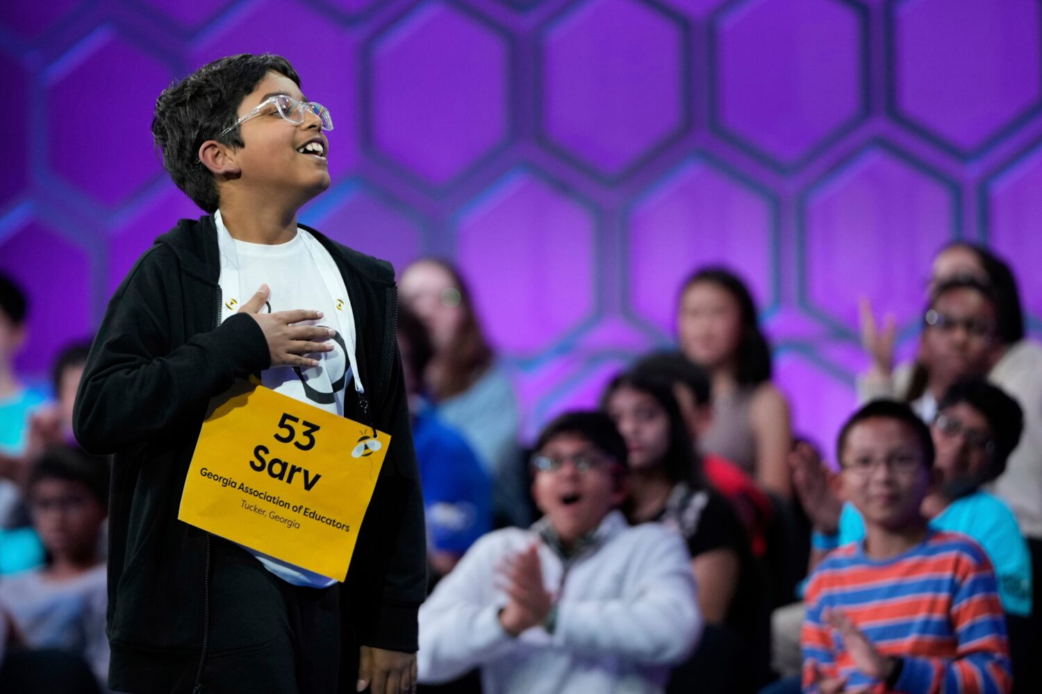 FILE - Sarv Dharavane, 11, of Tucker, Ga., reacts after spelling his word correctly in the finals o...