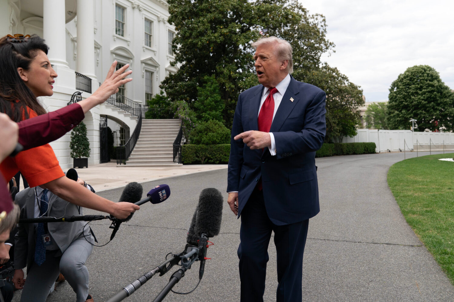 President Donald Trump speaks to reporters as he walks to board Marine One on the South Lawn of the...