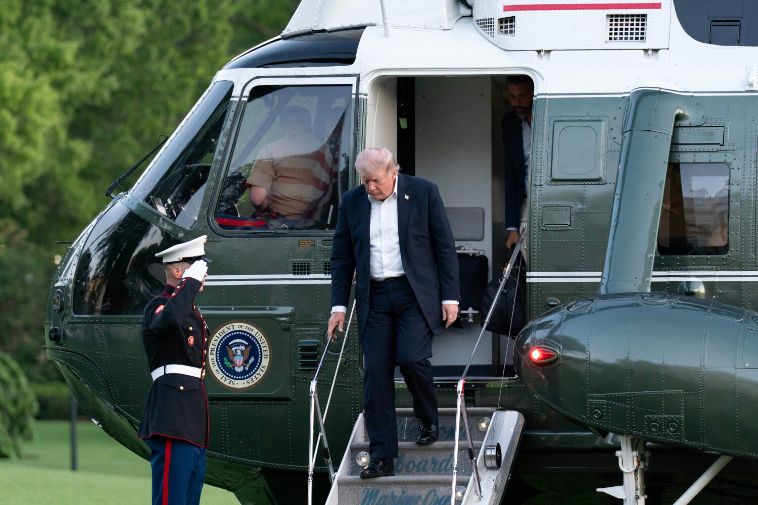 President Donald Trump steps off from Marine One upon his arrival at the South Lawn of the White Ho...
