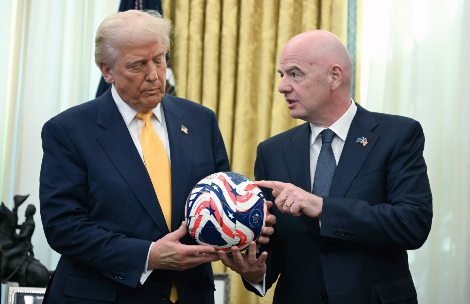 FILE - FIFA President Gianni Infantino, right, presents President Donald Trump with the new FIFA Cl...