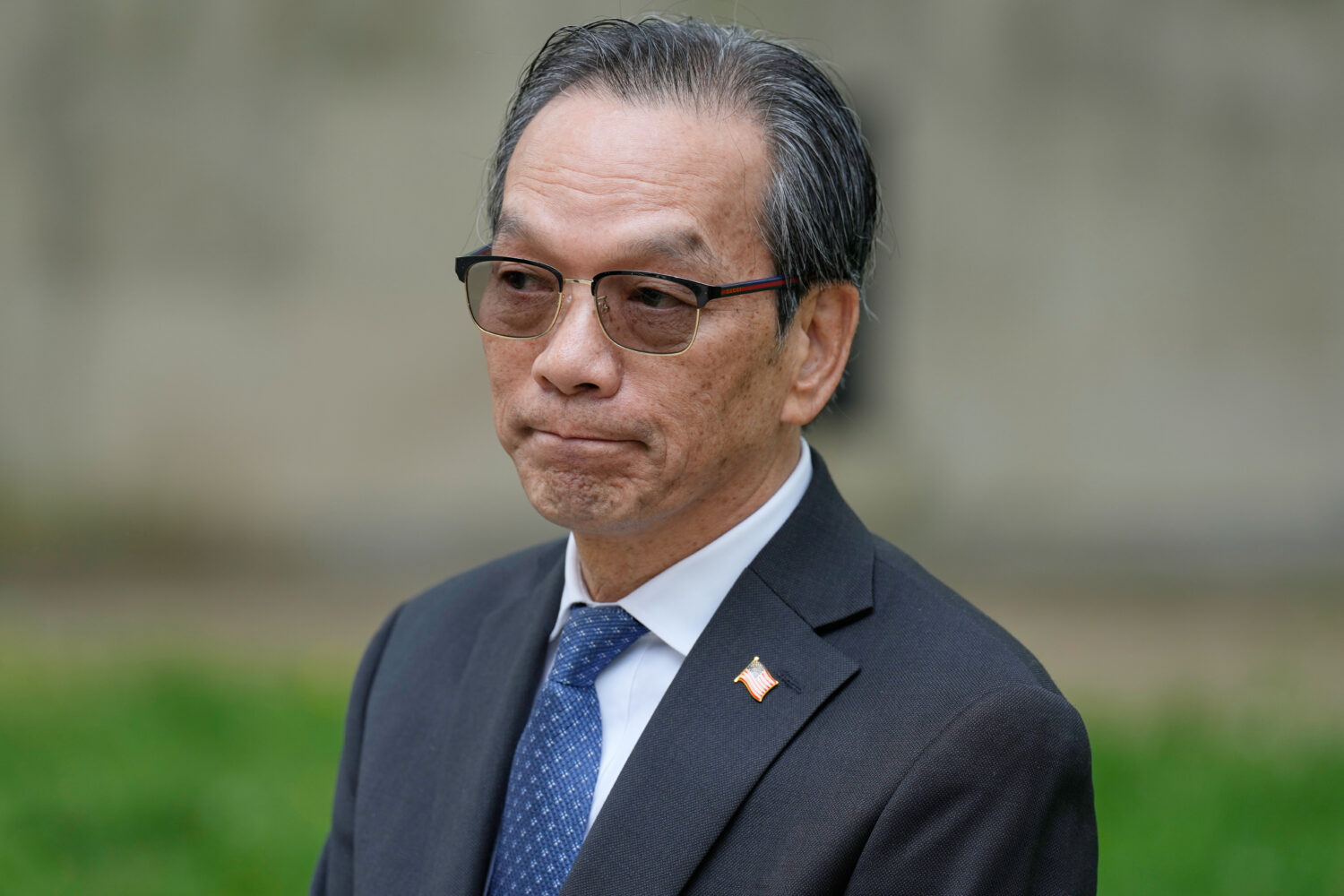 Lu Jianwang waits to enter a federal courthouse in New York, Wednesday, May 6, 2026. (AP Photo/Seth...