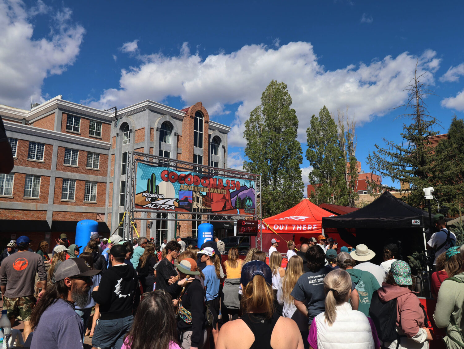 A crowd gathers to watch runners finish the Cocodona 250 ultramarathon in downtown Flagstaff, Ariz....