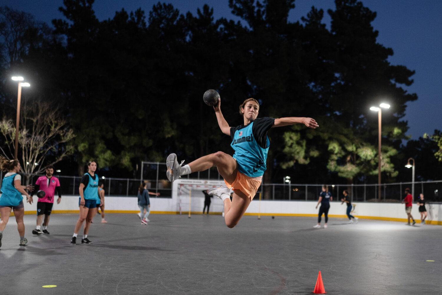 Devyn Holbrook takes a jump shot during a handball training session in Tustin, Calif., Wednesday, M...