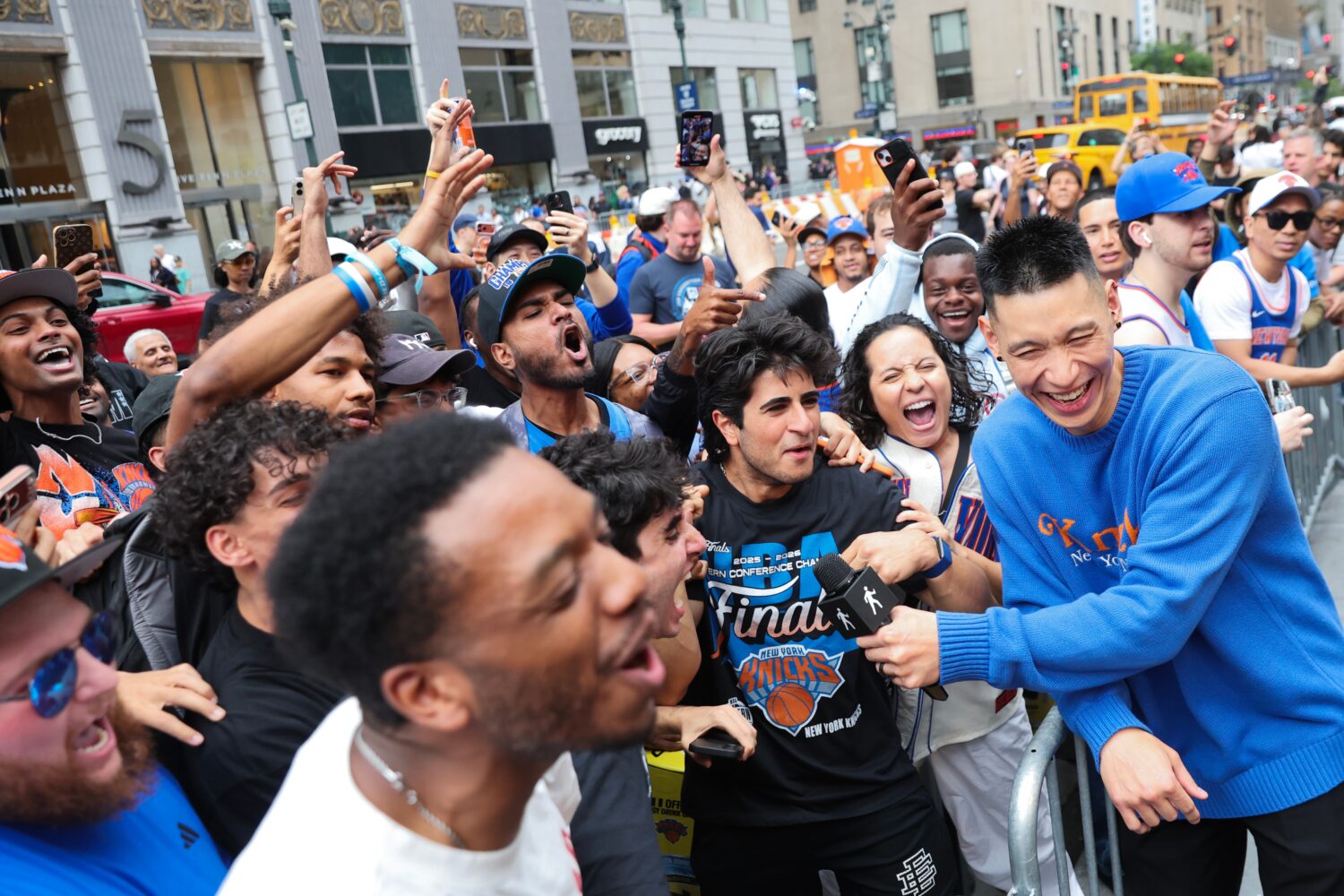 Former New York Knicks player Jeremy Lin, right, interviews Knicks fans outside of Madison Square G...