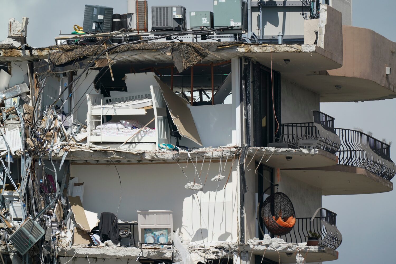 FILE - Furniture sits perched in the remains of apartments sheared in half in the still standing po...