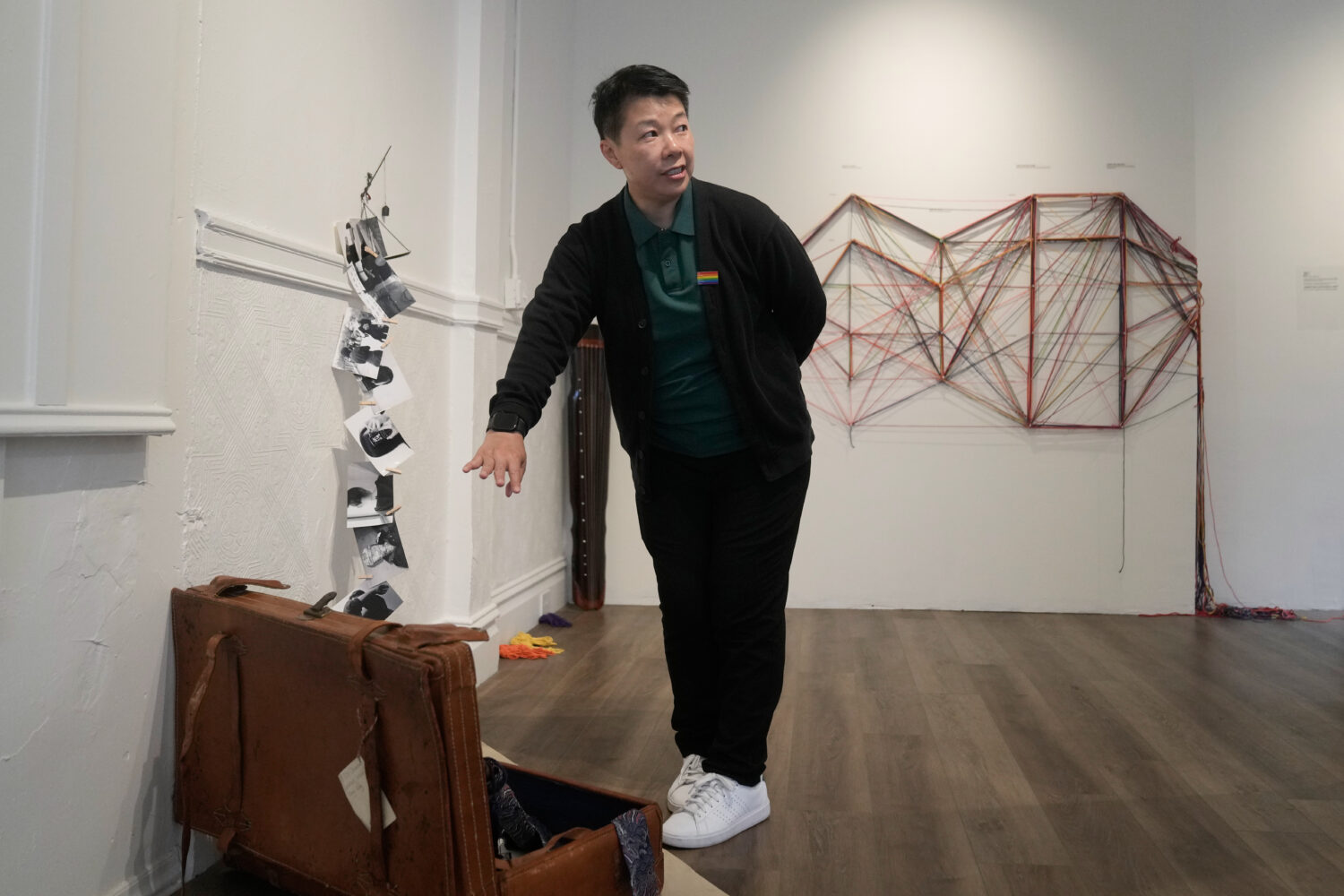 OUT Museum founder Xiangqi Chen gestures toward her art piece, "The Weight of Kindness," displayed ...