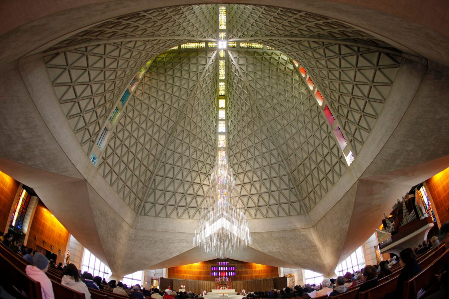 FILE - Parishioners attend a service at St. Mary's Cathedral, the mother church of the archdiocese ...