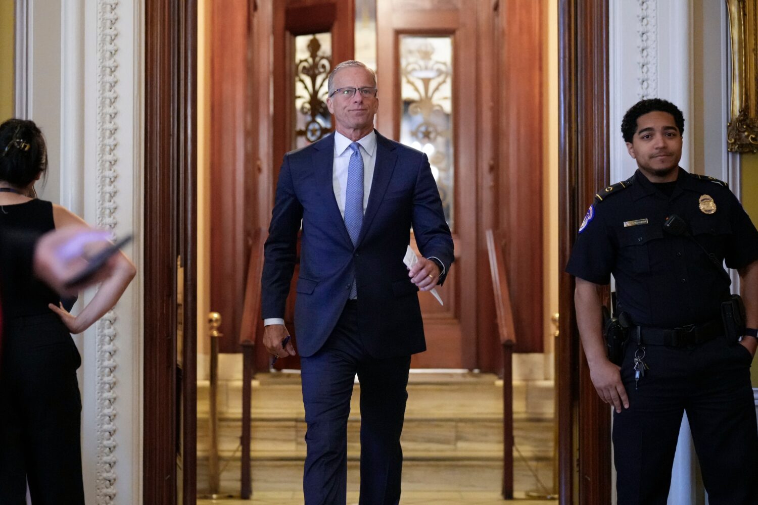 Senate Majority Leader John Thune, R-S.D., leaves the chamber, at the Capitol in Washington, Thursd...