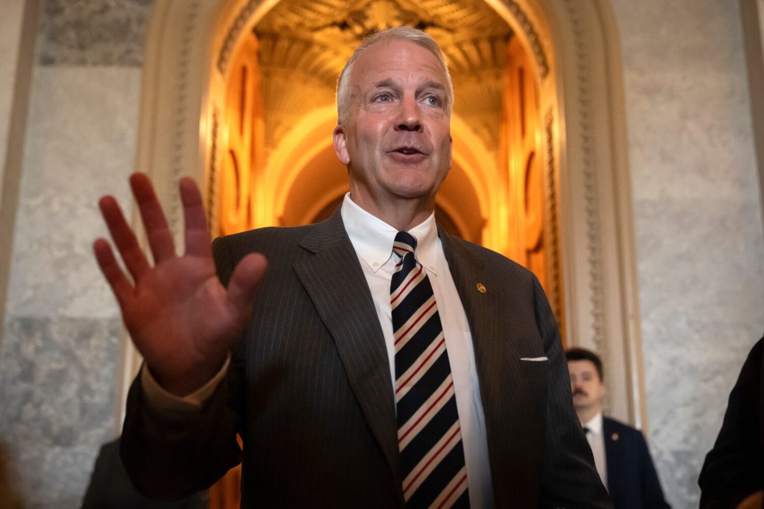 FILE - Sen. Dan Sullivan, R-Alaska, speaks to reporters at the Capitol in Washington, June 30, 2025...