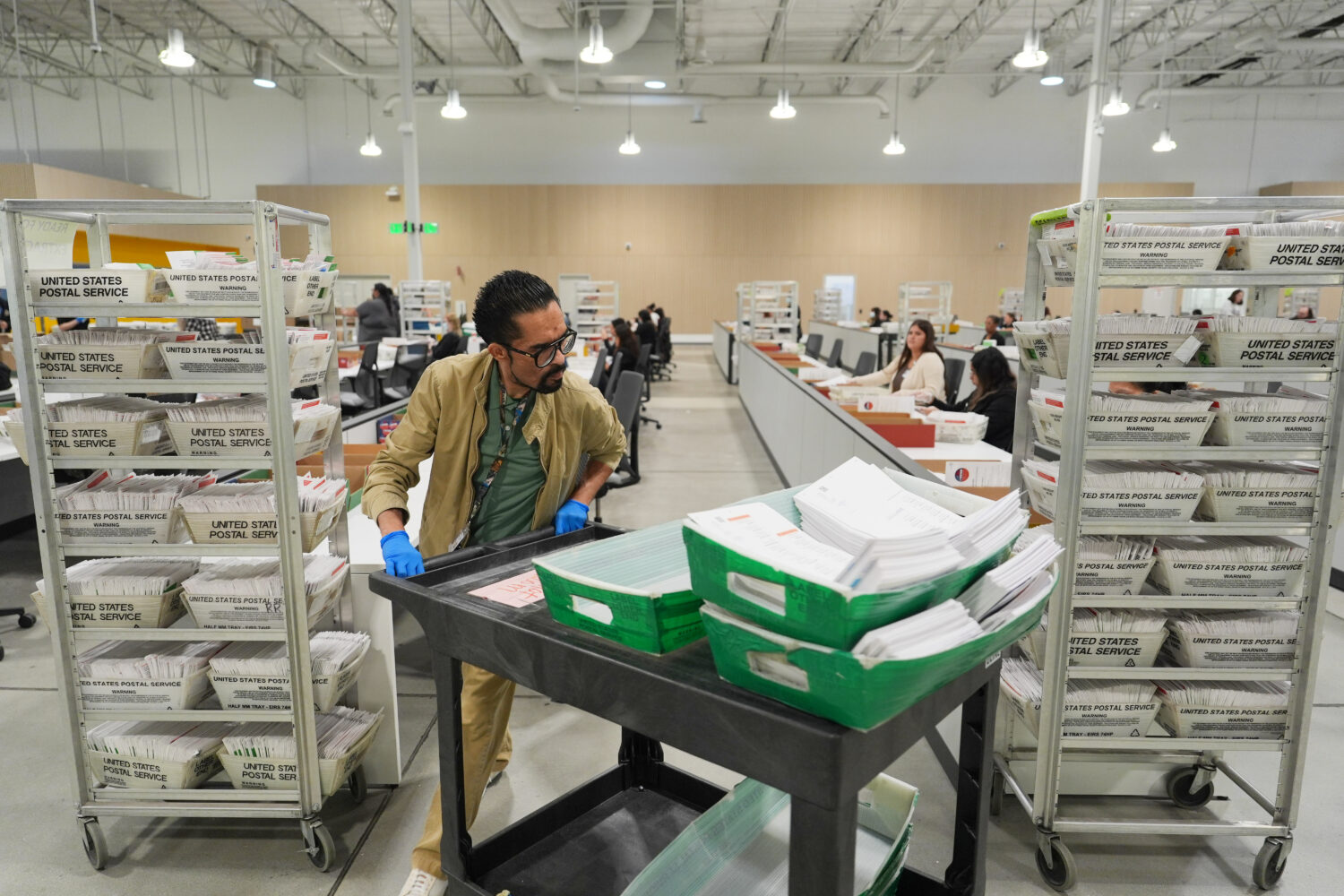 Ballots are sorted the day after California's primary election at the LA County Ballot Processing C...