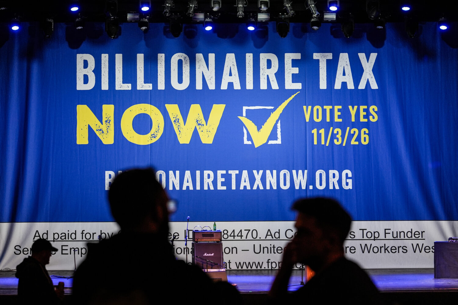 FILE - A large banner is seen at a campaign event for a proposed "billionaires tax" in Los Angeles ...