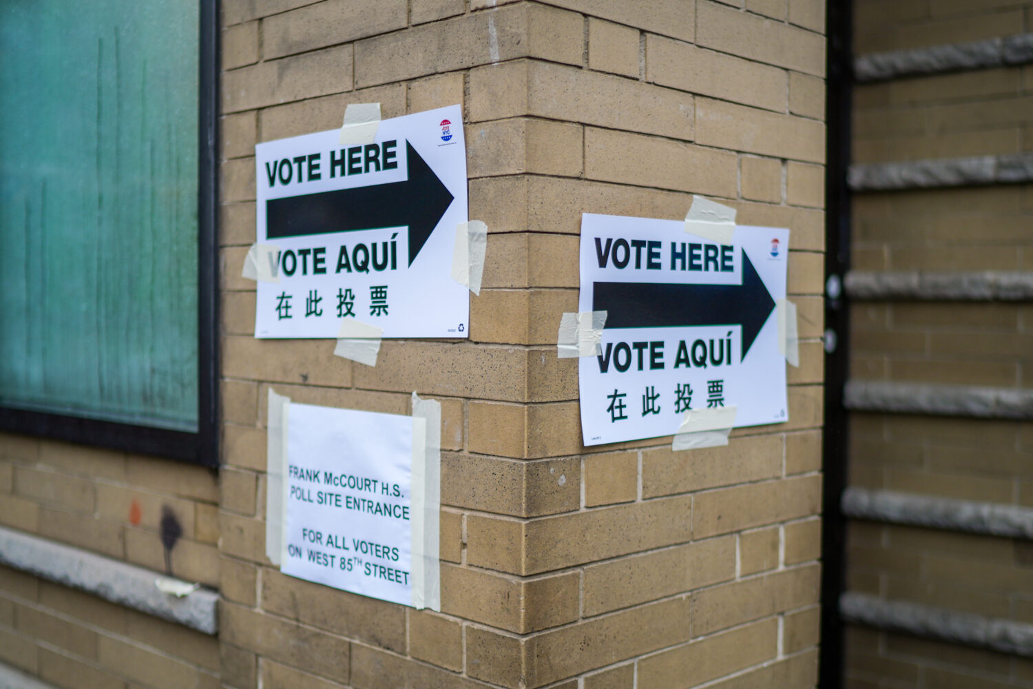 Voting signs are displayed outside a polling station on Election Day during New York’s primary el...