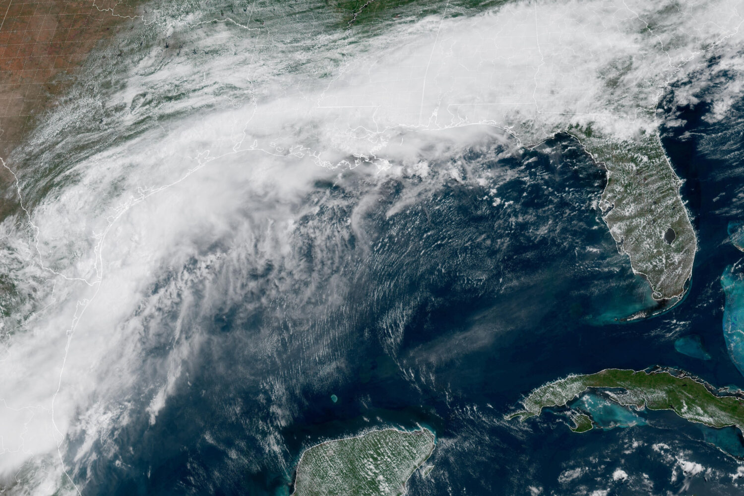 This GOES-19 GeoColor satellite image provided by NOAA, shows a storm system forming along the Gulf...