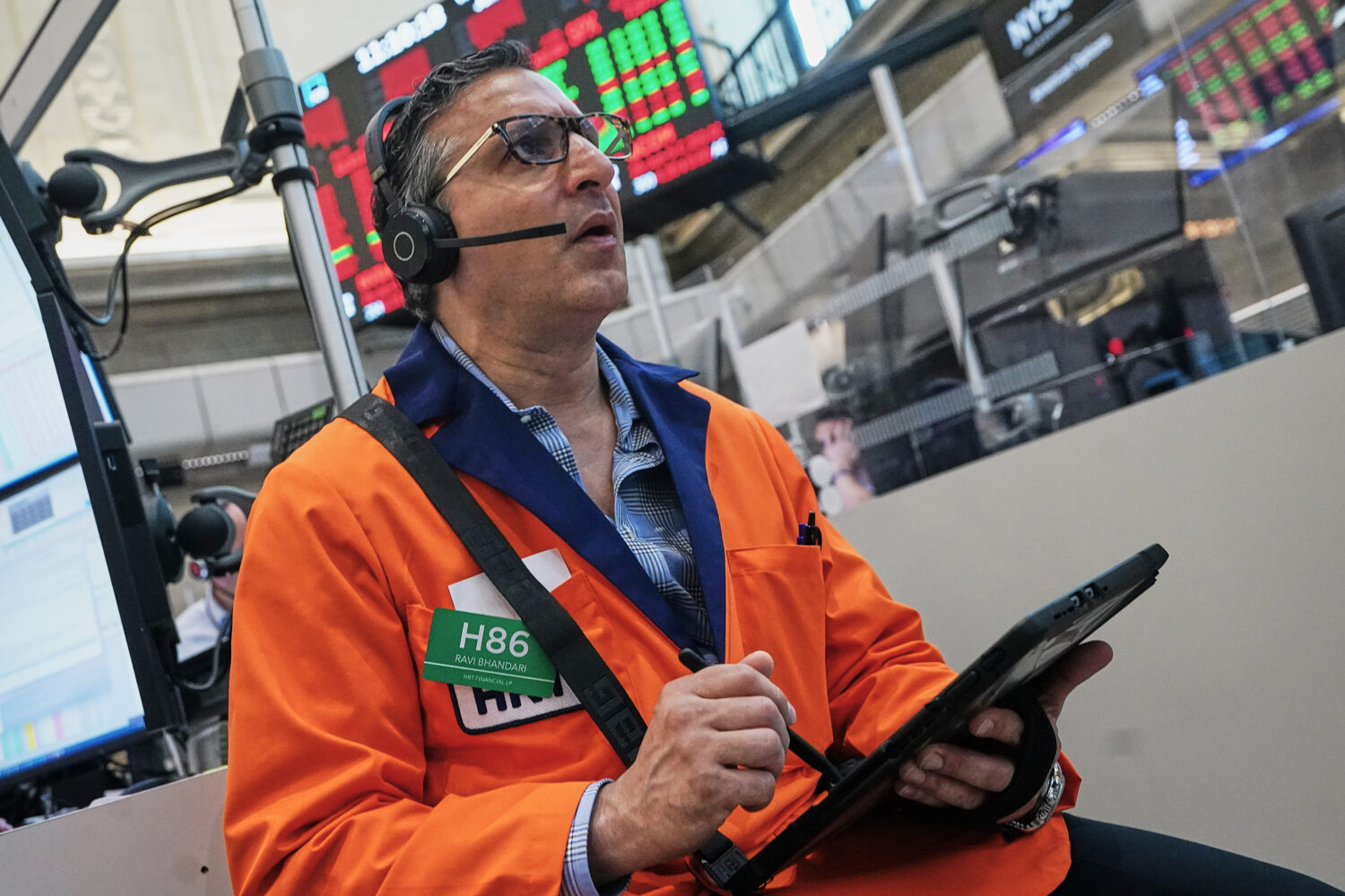 Options trader Ravi Bhandari works on the floor of the New York Stock Exchange, Wednesday, June 3, ...