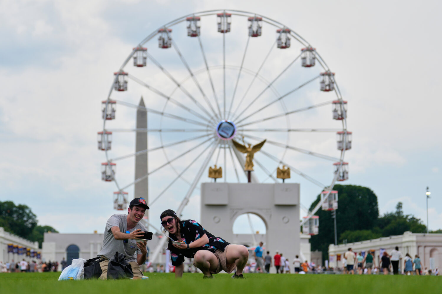 Christine Bayly, right, and Jason Brown, left, take a photo as they eat lunch on the National Mall ...