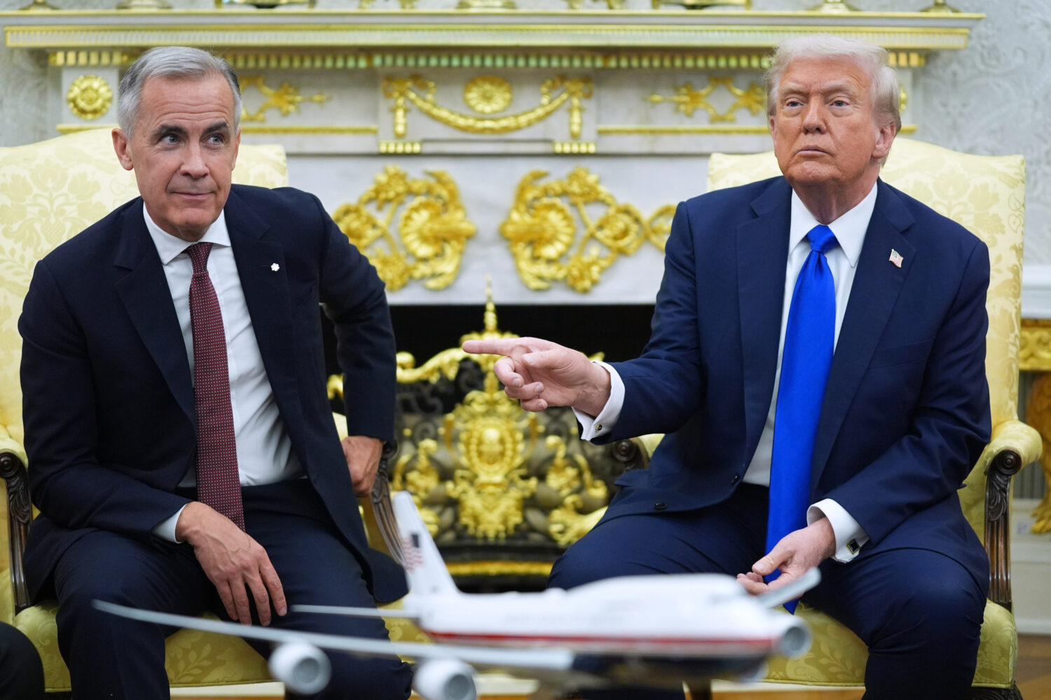 FILE - President Donald Trump and Canadian Prime Minister Mark Carney meet in the Oval Office of th...