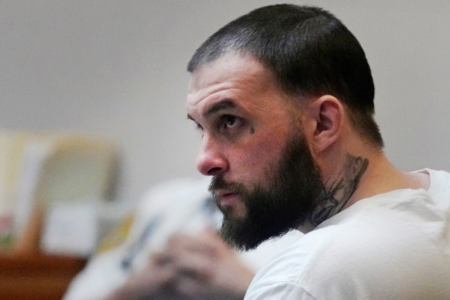 FILE - Adam Montgomery listens during his sentencing hearing at Hillsborough Superior Court, May 9,...