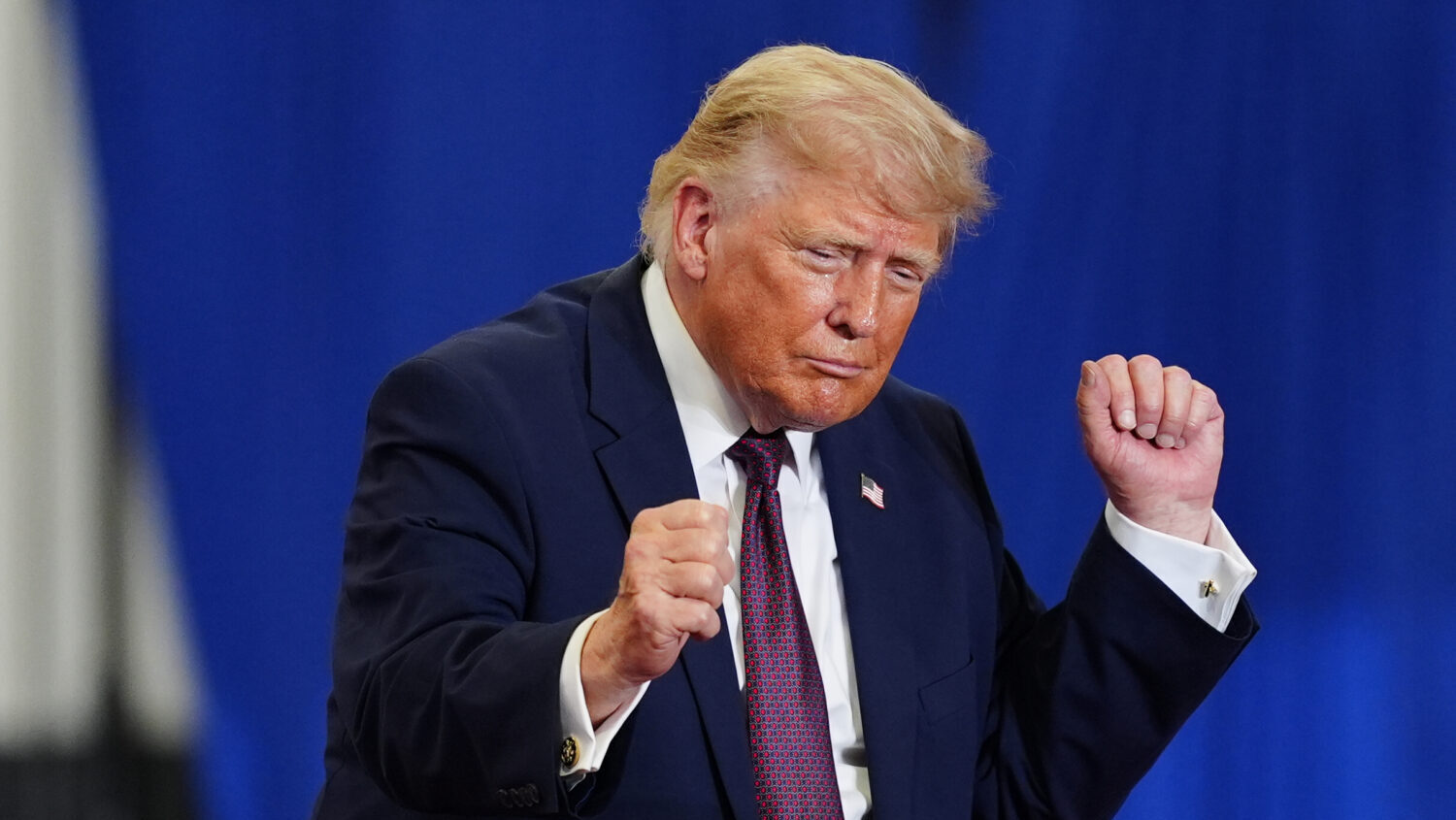 President Donald Trump dances on stage at a Mack Trucks facility, Tuesday, June 23, 2026, in Macung...