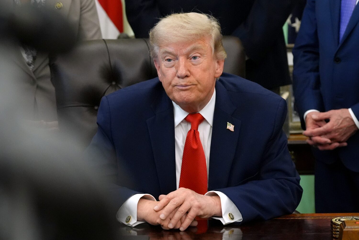 President Donald Trump listens during an event to sign a proclamation about the fishing industry, i...