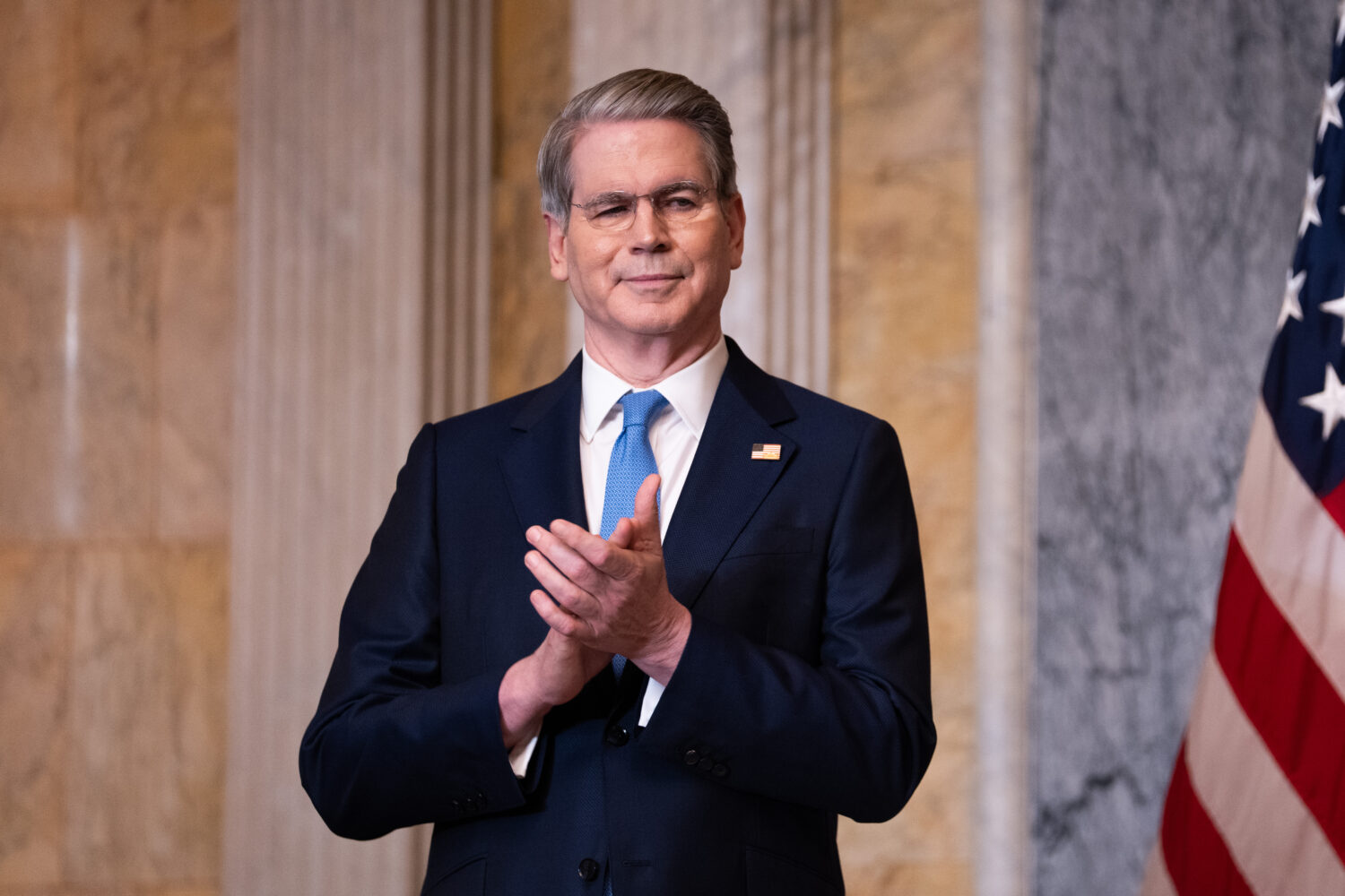 Treasury Secretary Scott Bessent applauds during an event about Trump Accounts for children in fost...
