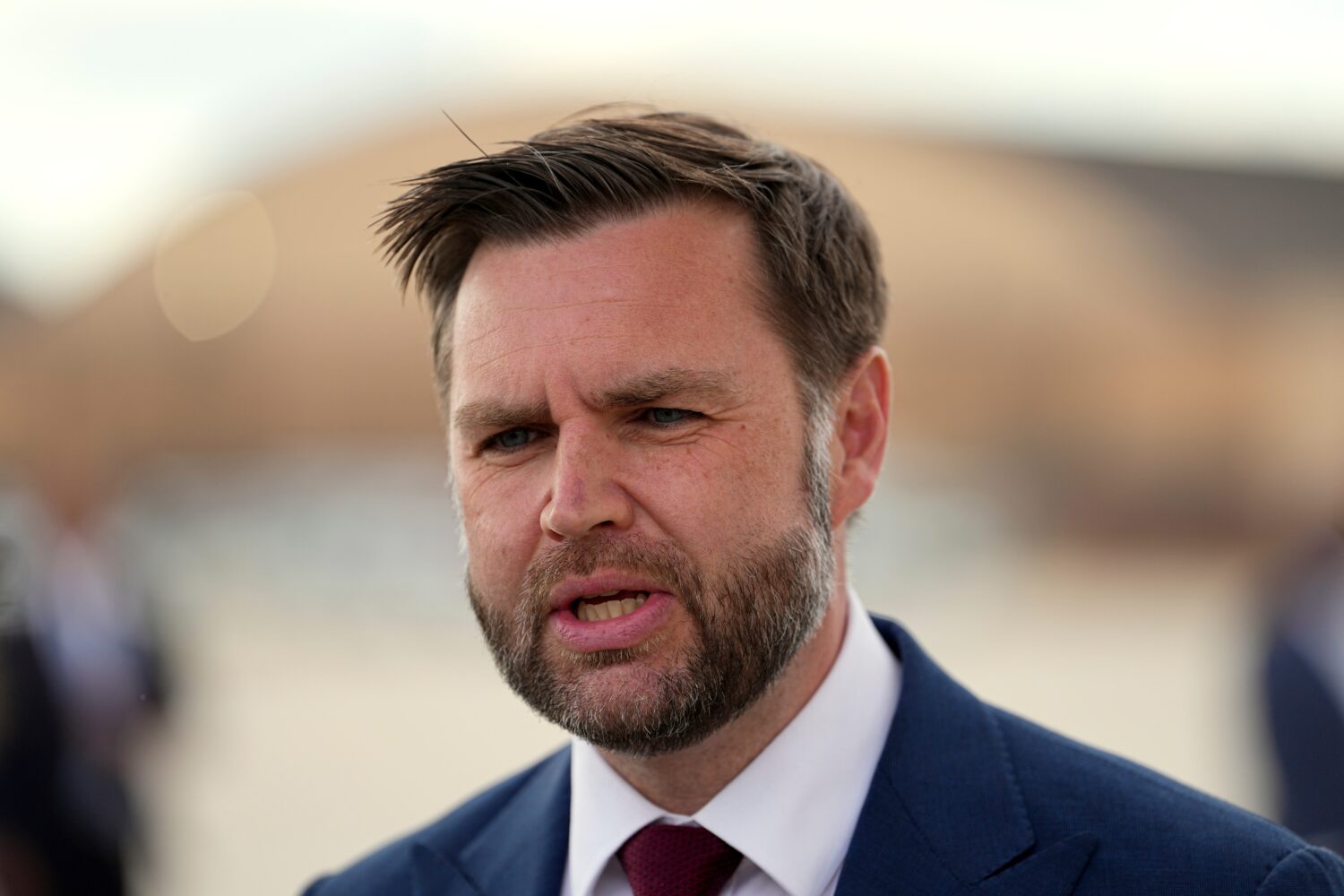 Vice President JD Vance speaks with reporters upon arriving on Air Force Two at Joint Base Andrews,...