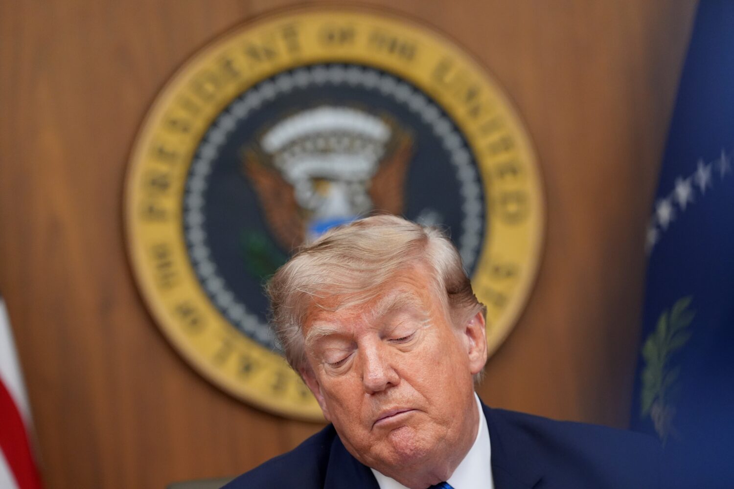 President Donald Trump listens during a cabinet meeting, Friday, July 31, 2026, at Camp David, the ...